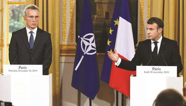 Macron and Stoltenberg at the news conference following their meeting at the Elysee palace in Paris.