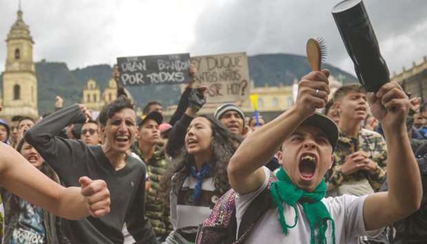 Colombians shout slogans during a demonstration in Bogota on Wednesday.