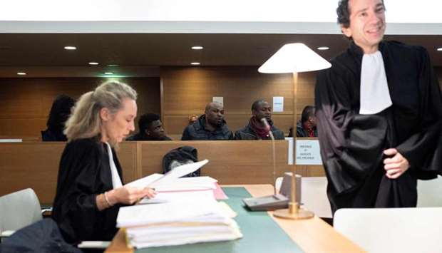 Nigerians defendants attending the start of a trial of a prostitution network case in Lyon, central eastern France on November 6