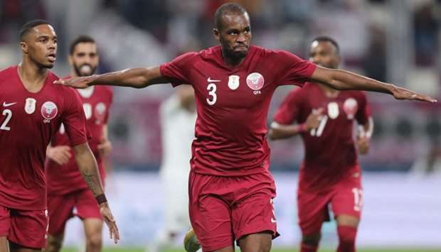 Qatar's defender Abdelkarim Hassan (C) celebrates after scoring during the 24th Arabian Gulf Cup Group A football match between Yemen and Qatar at the Khalifa International Stadium, Doha
