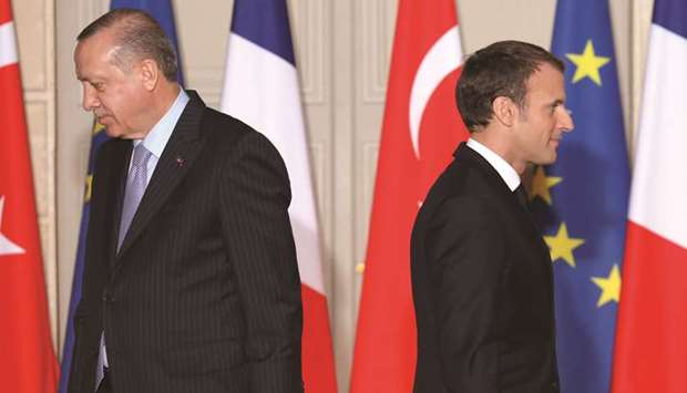 This file photo taken on January 5 last year shows Macron and Erdogan walk away after a joint press conference at the Elysee Palace in Paris.