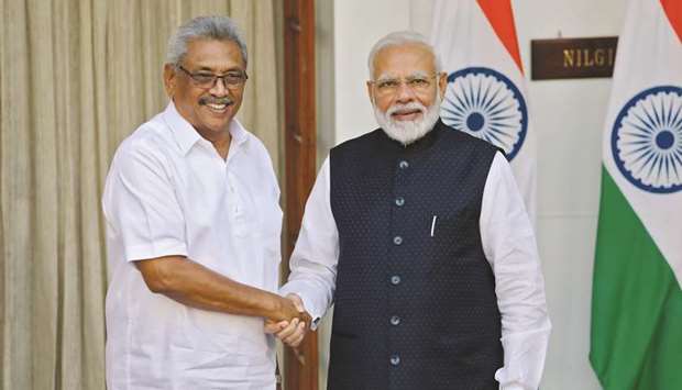Sri Lankau2019s President Gotabaya Rajapaksa and Indiau2019s Prime Minister Narendra Modi shake hands during a photo opportunity ahead of their meeting at Hyderabad House in New Delhi yesterday.