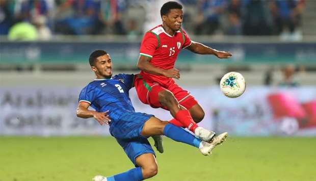 Oman's Al Mandhar Al Alawi in action with Kuwait's Sami Al-Sanea