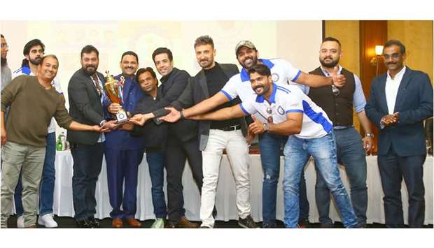 GROUP: Indian film celebrities and organisers pose with the match trophy. tttttttt                               Photos by Jayan Orma