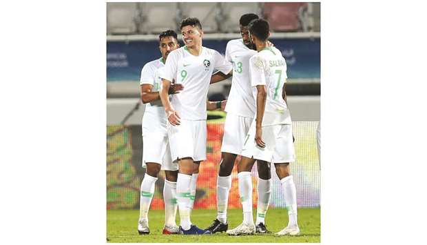 Saudi Arabiau2019s Abdullah al-Hamdan (second from left) celebrates his goal with teammates during the 24th Arabian Gulf Cup match against Bahrain at Abdullah Bin Khalifa Stadium. PICTURE: Anas Khalid