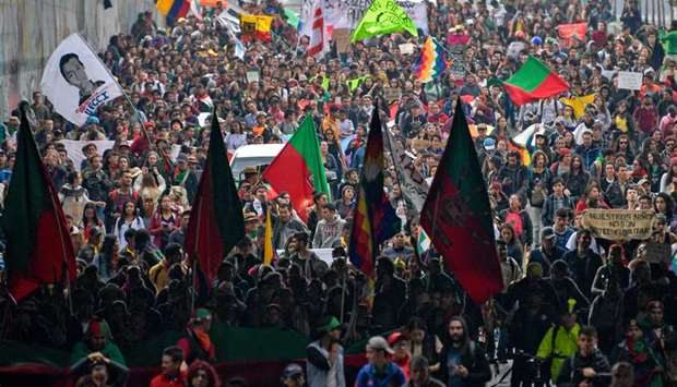 Colombian indigenous people and students protest against the government of Colombian President Ivan Duque in Bogota on Friday.