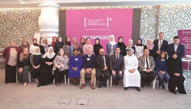 Participants of the Qatar University ExxonMobil Teachers Academy with officials.