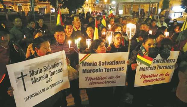 Demonstrators against Boliviau2019s President Evo Morales take part in a march, mourning the deaths of fellow protesters, in downtown La Paz on Friday night.