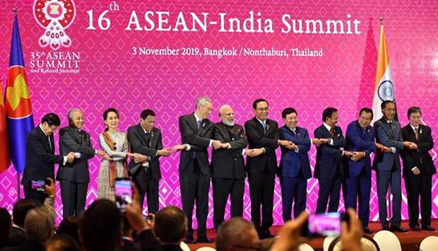 (From L to R) Laos' Prime Minister Thongloun Sisoulith, Malaysia's Prime Minister Mahathir Mohamad, Myanmar's State Counsellor Aung San Suu Kyi, Philippines' President Rodrigo Duterte, Singapore's Prime Minister Lee Hsien Loong, India's Prime Minister Narendra Modi, Thailand's Prime Minister Prayut Chan-O-Cha, Vietnam's Foreign Minister Pham Binh Minh, Brunei's Sultan Hassanal Bolkiah, Cambodia's Prime Minister Hun Sen, Indonesia's President Joko Widodo and ASEAN Secretary-General Lim Jock Hoi pose for a group photo during the 16th ASEAN-India Summit in Bangkok .