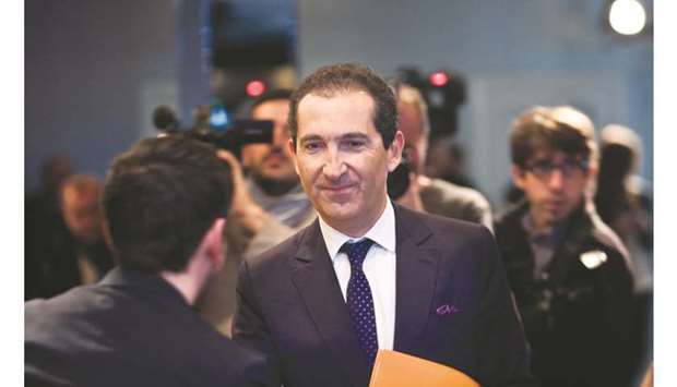 Patrick Drahi greets an attendee ahead of a news conference in Paris. The French billionaire plans to achieve $66mn in cost savings at Sothebyu2019s, amounting to about 43% of adjusted earnings before interest, taxation, depreciation and amortisation in the second quarter. A big portion of that u2014 some $31mn u2014 reflects the end of share-based compensation.