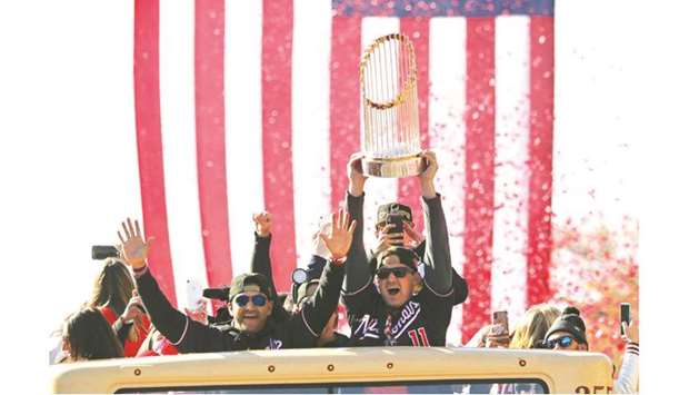 Washington Nationals players show off their trophy during the World Series championship parade in Washington, United States, on Saturday. (Reuters)