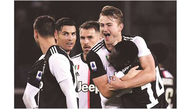 Juventus are top of Serie A thanks to Matthijs de Ligtu2019s (second right) derby winner in their 1-0 triumph at Torino on Saturday. (AFP)