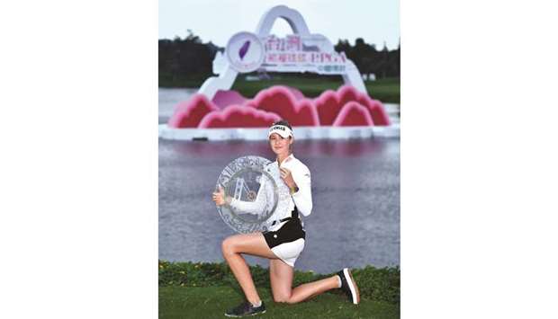 Nelly Korda of the US poses with her trophy after winning the Taiwan Swinging Skirts LPGA tournament yesterday. (AFP)
