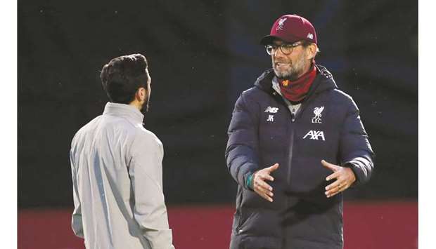 Liverpool manager Jurgen Klopp (right) with Adam Lallana during training. (Reuters)