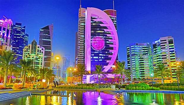 The Doha Bank Headquarters Tower lit up in pink.rnrn