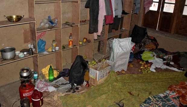 Belongings of labourers, who were killed by unidentified gunmen on Tuesday, are seen inside their rented room in Katrasoo village in south Kashmir's Kulgam district