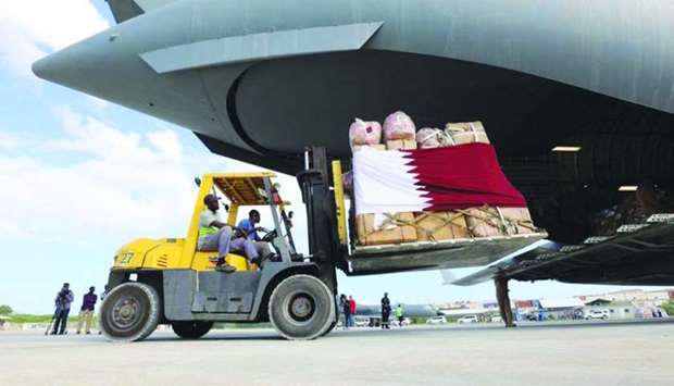The first consignment of relief items sent by Qatar to help flood victims in the affected areas of Somalia being unloaded in Mogadishu.
