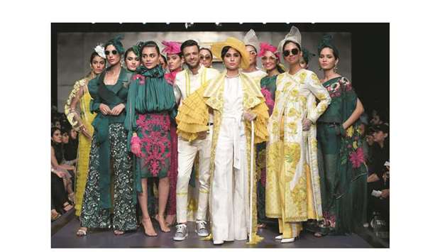 SIGNING OFF: Hassan Riaz takes a bow with his collection u2018Lost in the French gardenu2019 on the first day of FPW-Winter Festive.