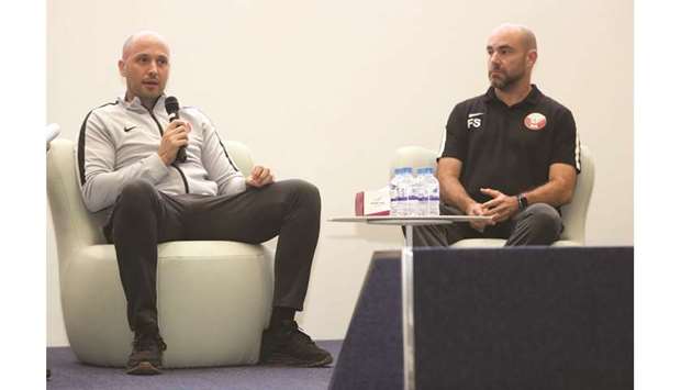 Qataru2019s football coach Felix  Sanchez (right) and Dr. Alberto Mendez-Villanueva, head of Fitness at Qatar Football Association, speak during the 4th Association of Sports Institutes in Asia congress at the Aspire Academy yesterday.