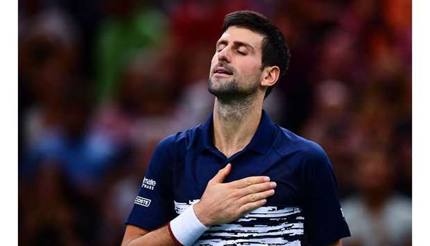 Novak Djokovic celebrates after winning his semi-final match against Bulgariau2019s Grigor Dimitrov at the Paris Masters in Paris on Saturday. (AFP)