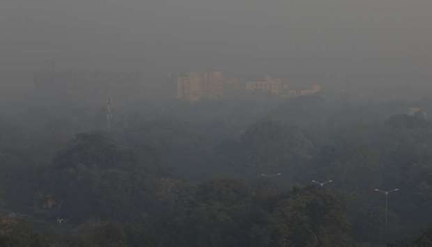 Buildings are seen shrouded in smog in New Delhi yesterday