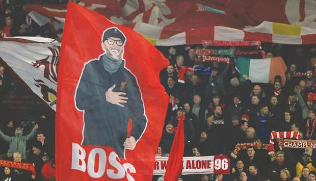 Fans hold up a banner of Liverpool manager Juergen Klopp before the match against KRC Genk at Anfield in Liverpool, United Kingdom, on Tuesday. (Reuters)