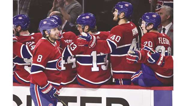 Ben Chiarot of the Montreal Canadiens celebrates his goal with teammates on the bench against the Boston Bruins at the Bell Centre in Montreal on Tuesday.