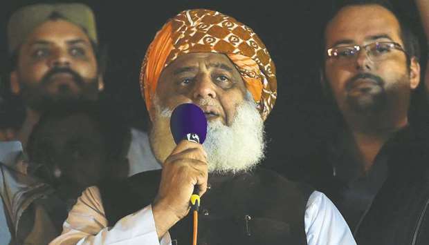 BOXED INTO A CORNER: Fazlur Rehman addressing the JUI-F sit-in in Islamabad. AFP