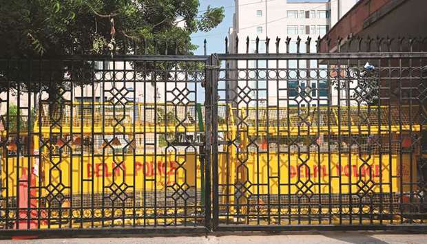 A locked gate of the Saket court complex is pictured as lawyers locked themselves inside after days of confrontation with police, in New Delhi yesterday.