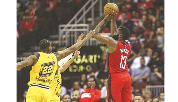 Houston Rockets guard James Harden (right) shoots the ball as Golden State Warriors forward Glenn Robinson III defends during the second quarter of the NBA game at Toyota Center in Houston, Texas, United States, on Wednesday. (USA TODAY Sports)