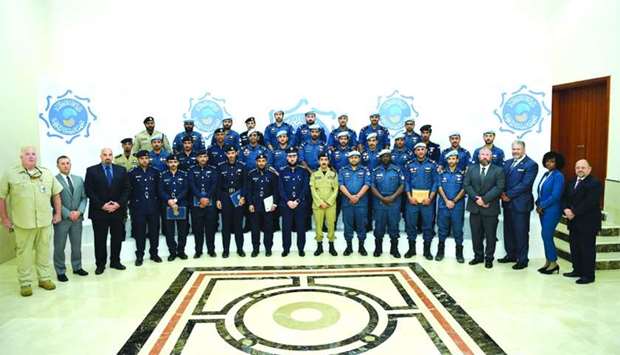 The officers pose for a group photo at the conclusion of the course.rnrn