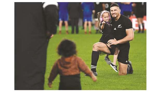 In this November 1, 2019, picture, New Zealandu2019s centre Sonny Bill Williams holds his daughter after winning the Japan 2019 Rugby World Cup bronze final match against Wales in Tokyo, Japan. (AFP)