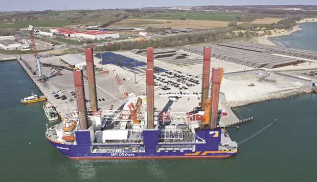 The MPI Resolution turbine installation vessel sits moored as sections of pipe for the Nord Stream 2 gas pipeline is seen on the dock at Mukran Port in Sassnitz, Germany. Lawmakers in Germany are set to anchor the revised EU gas rules into national law, according to Stefan Rolle, an adviser in Germanyu2019s Economy & Energy Ministry.