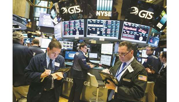 Traders work on the floor of the New York Stock Exchange (file). Trading income at 12 of the largest global investment banks plunged $39bn from 2010 to last year, according to data from analytics firm Coalition. Adding this yearu2019s slide, itu2019s roughly the equivalent of both Goldman Sachs and JPMorgan Chase vanishing.