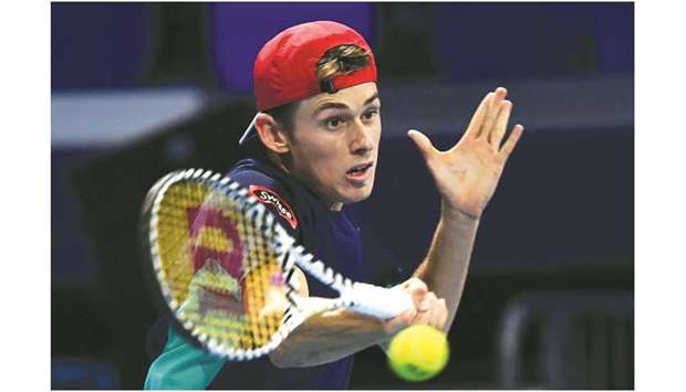 Alex de Minaur hits a return to Frances Tiafoe during their semi-final match of the ATP Finals at the Allianz Cloud Court in Milan on Friday. (AFP)