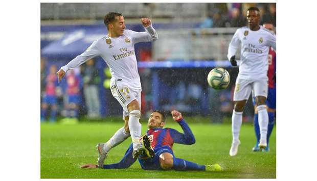 Real Madridu2019s Vazquez (left) vies for the ball with Eibaru2019s Pedro Bigas during the La Liga match . AFP)