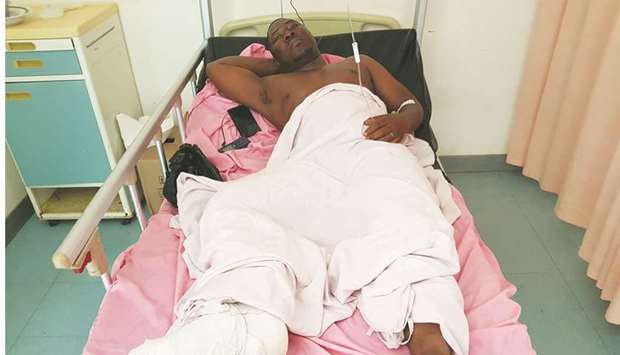 Sanou Bakary, 36, who was injured during an attack on a road leading to the Boungou mine, operated by Canadian gold miner Semafo, lies in a hospital bed in Ouagadougou, Burkina Faso, on Friday.