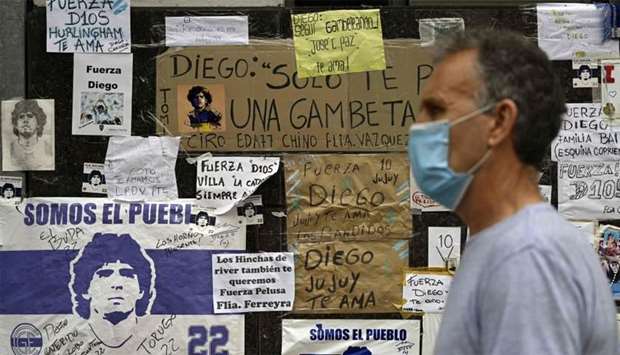 Messages of support are seen outside the private clinic where Argentine former football star and coach of Gimnasia y Esgrima La Plata Diego Maradona underwent a brain surgery for a blood clot, in Olivos, Buenos Aires Province