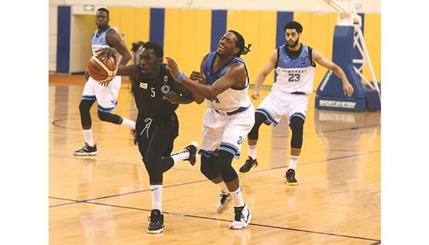 Al Sadd (in black) and Al Wakrah players vying for the ball during their Amir Cup basketball semi-final at the Al Gharafa Sports Club yesterday. PICTURES: Shemeer Rasheed