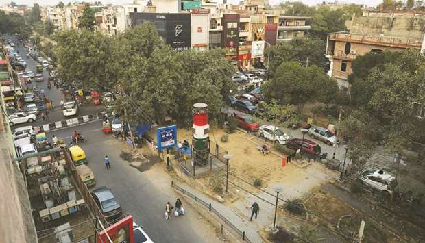 A u2018smog toweru2019, a 20ft-tall air-purifier, is seen at a market area in New Delhi yesterday.