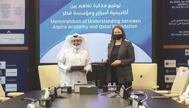 Deputy Director General of Aspire Academy Ali Salem Afifa (left) and Director of Community Engagement at Qatar Foundation Amy Johnson after signing the MoU on Wednesday.