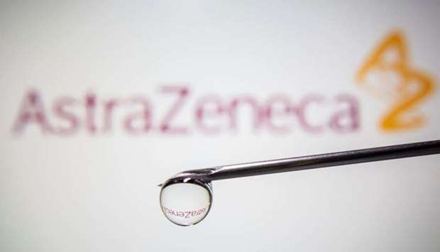 AstraZeneca's logo is reflected in a drop on a syringe needle