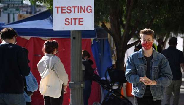 People wait in line to get tested for COVID-19 in Los Angeles, California