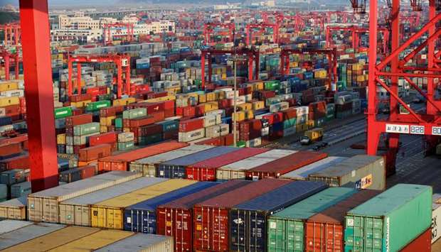 Container boxes are seen at the Yangshan Deep Water Port, part of the Shanghai Free Trade Zone, in Shanghai