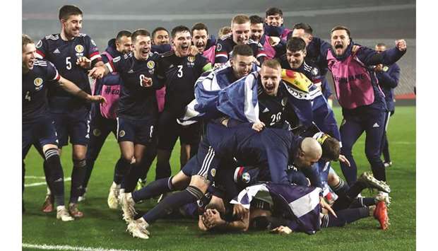 Scotland players celebrate after qualifying for the Euro 2020 at the Rajko Mitic Stadium in Belgrade, Serbia. (Reuters)