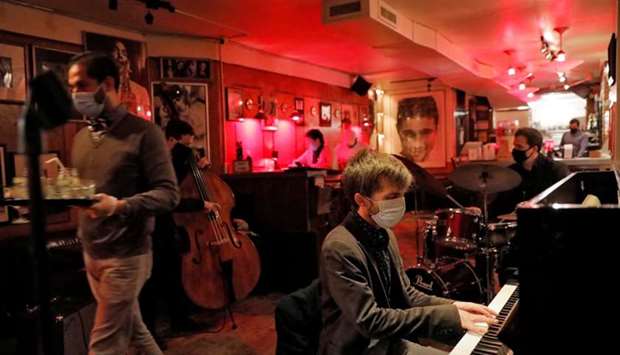 The Ryan Slatko Trio performs at Rue-B, a live jazz bar in the Alphabet City neighborhood of Manhattan, New York City as new restrictions were announced on bars and restaurants for 10 PM closure, to help fight the spread of the coronavirus disease.