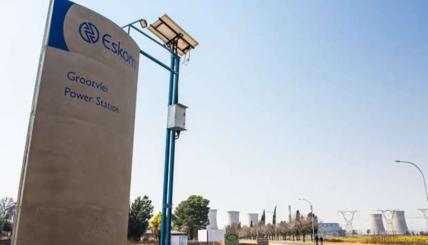 A sign stands outside the entrance road to the Eskom Holdings Grootvlei coal-fired power station in Mpumalanga, South Africa (file). Eskom u201chas an aspirational visionu201d of reaching the goal, which includes the creation of jobs, the utility said in a reply to questions.