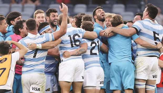 Argentinau2019s players celebrate their victory over New Zealand in their Tri-Nations rugby match at Bankwest Stadium in Sydney yesterday.