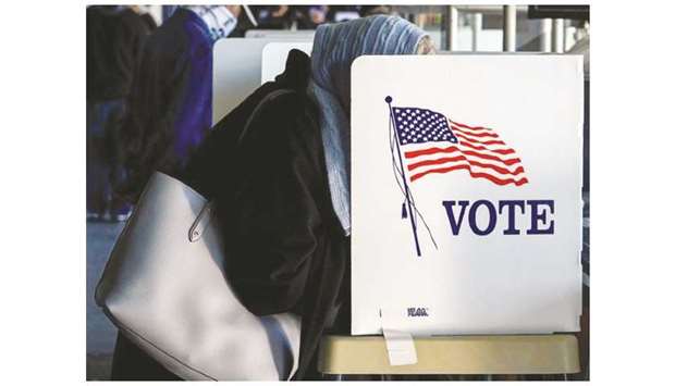 FOCUS: A Muslim voter fills out her ballot for the 2020 presidential race in Tulsa, Oklahoma. (Reuters)