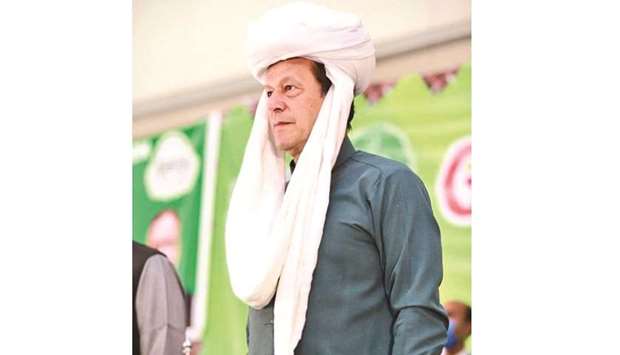 Prime Minister Imran Khan wearing a traditional Balochistani turban during the launch of the programme in the provincial capital Quetta yesterday.